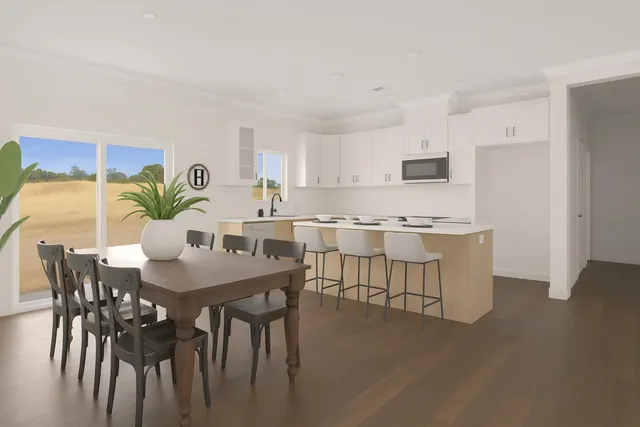 a view of kitchen with sink and dining table