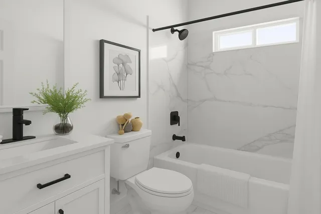 a bathroom with a sink a toilet a tub and shower