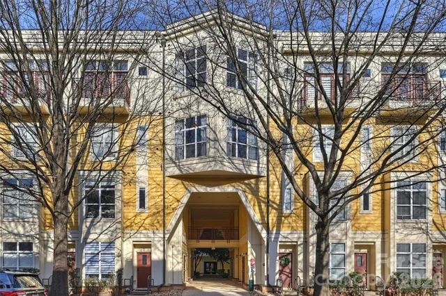 a view of a building with large trees