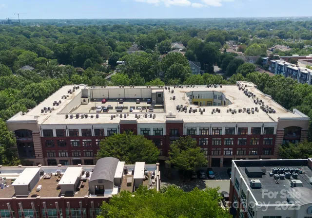 an aerial view of a house and a garden
