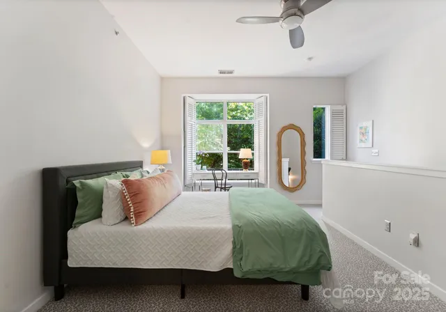 a bedroom with a bed and window