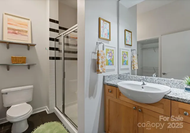 a bathroom with a sink toilet and shower