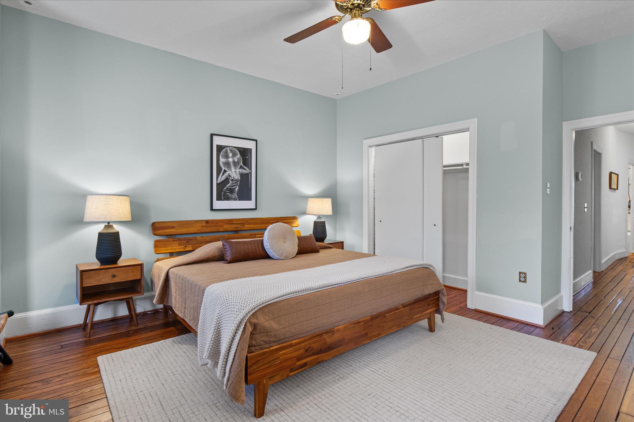 140 11th Street Northeast Washington, DC 20002 - Photo 20 of 45 a bedroom with a bed and a chandelier
