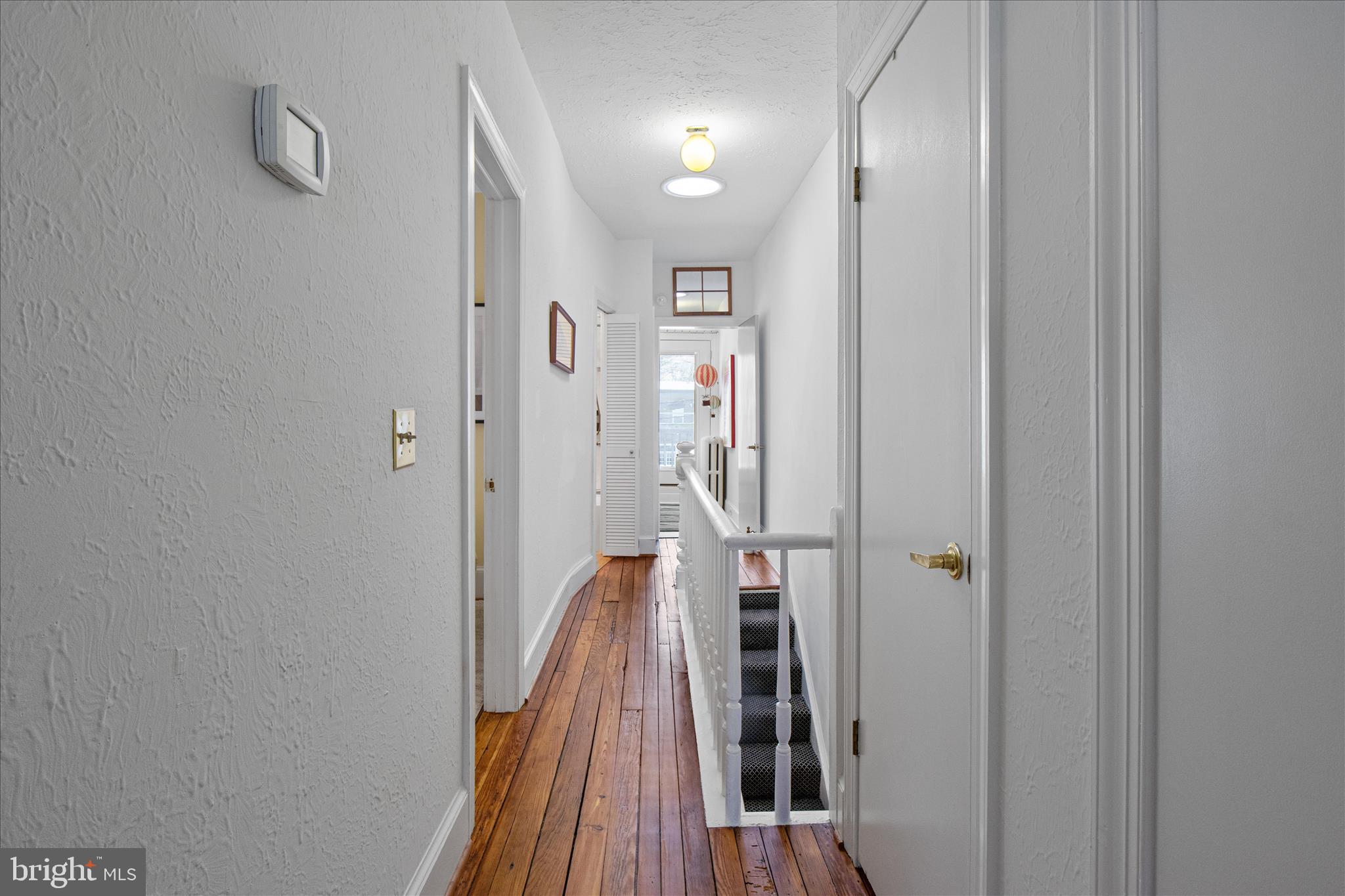 140 11th Street Northeast Washington, DC 20002 - Photo 22 of 45 a view of a hallway with wooden floor and staircase