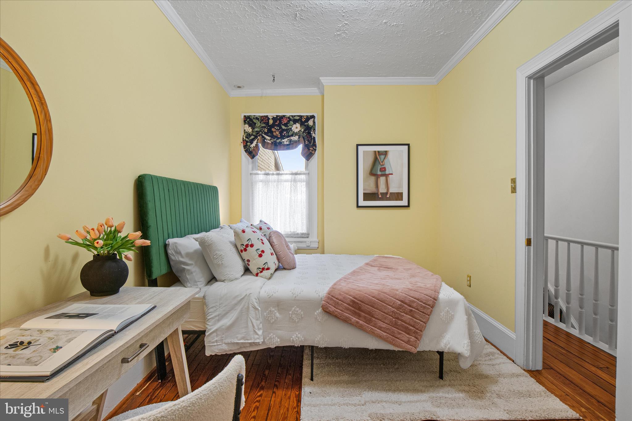 140 11th Street Northeast Washington, DC 20002 - Photo 23 of 45 a bedroom with a bed and a chandelier