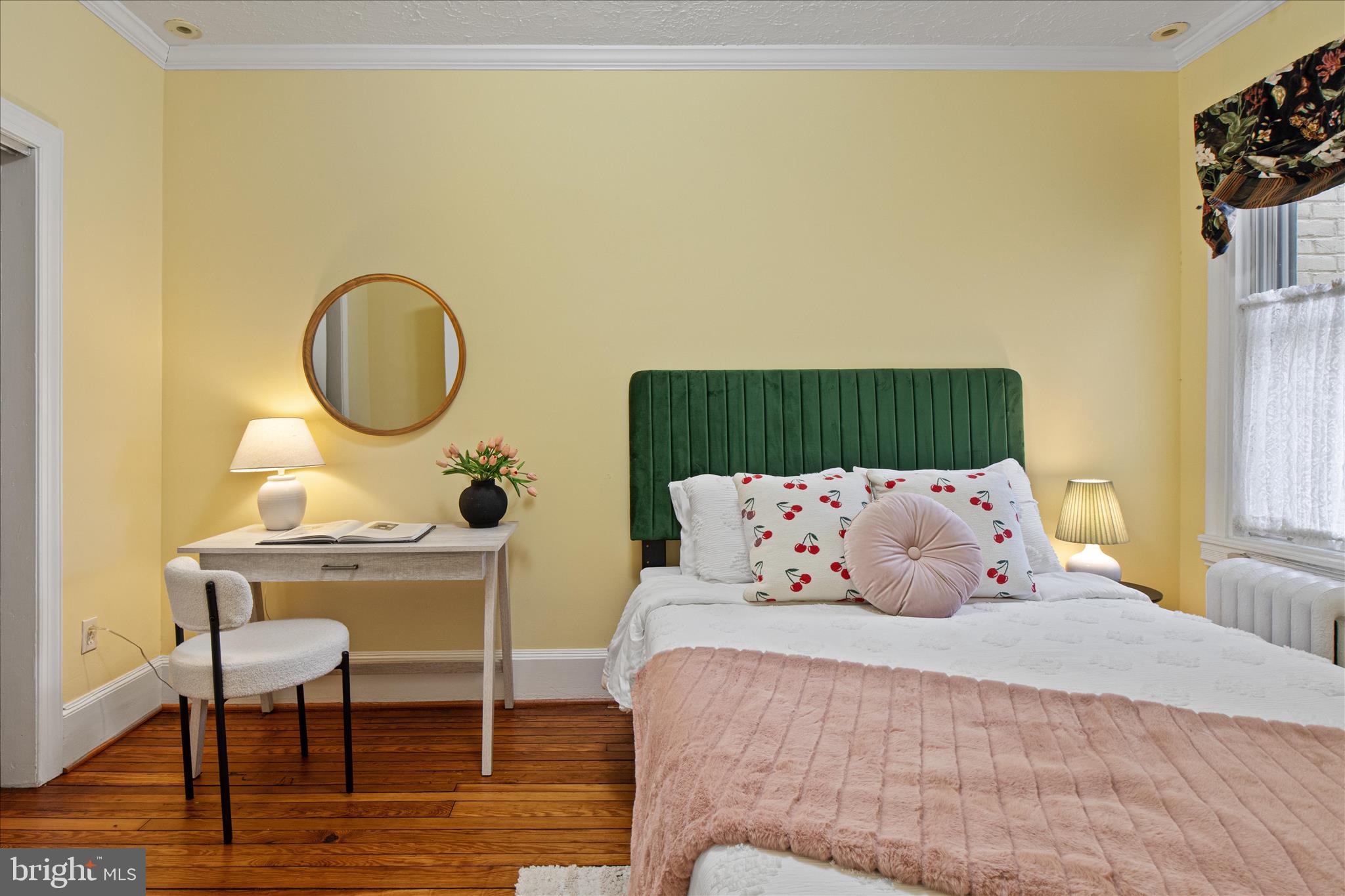 140 11th Street Northeast Washington, DC 20002 - Photo 24 of 45 a bedroom with a bed and a table