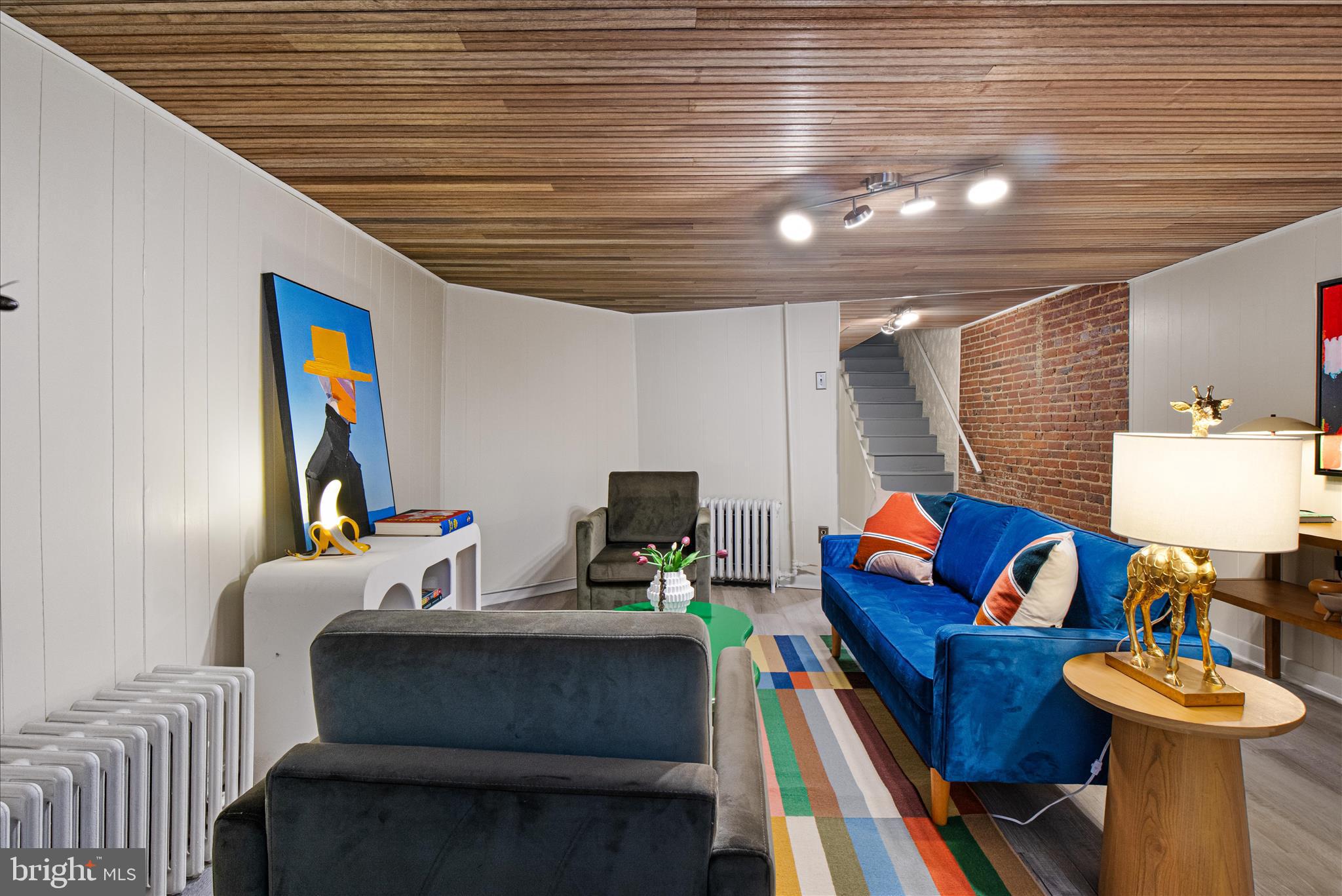 140 11th Street Northeast Washington, DC 20002 - Photo 34 of 45 a living room with furniture and a flat screen tv