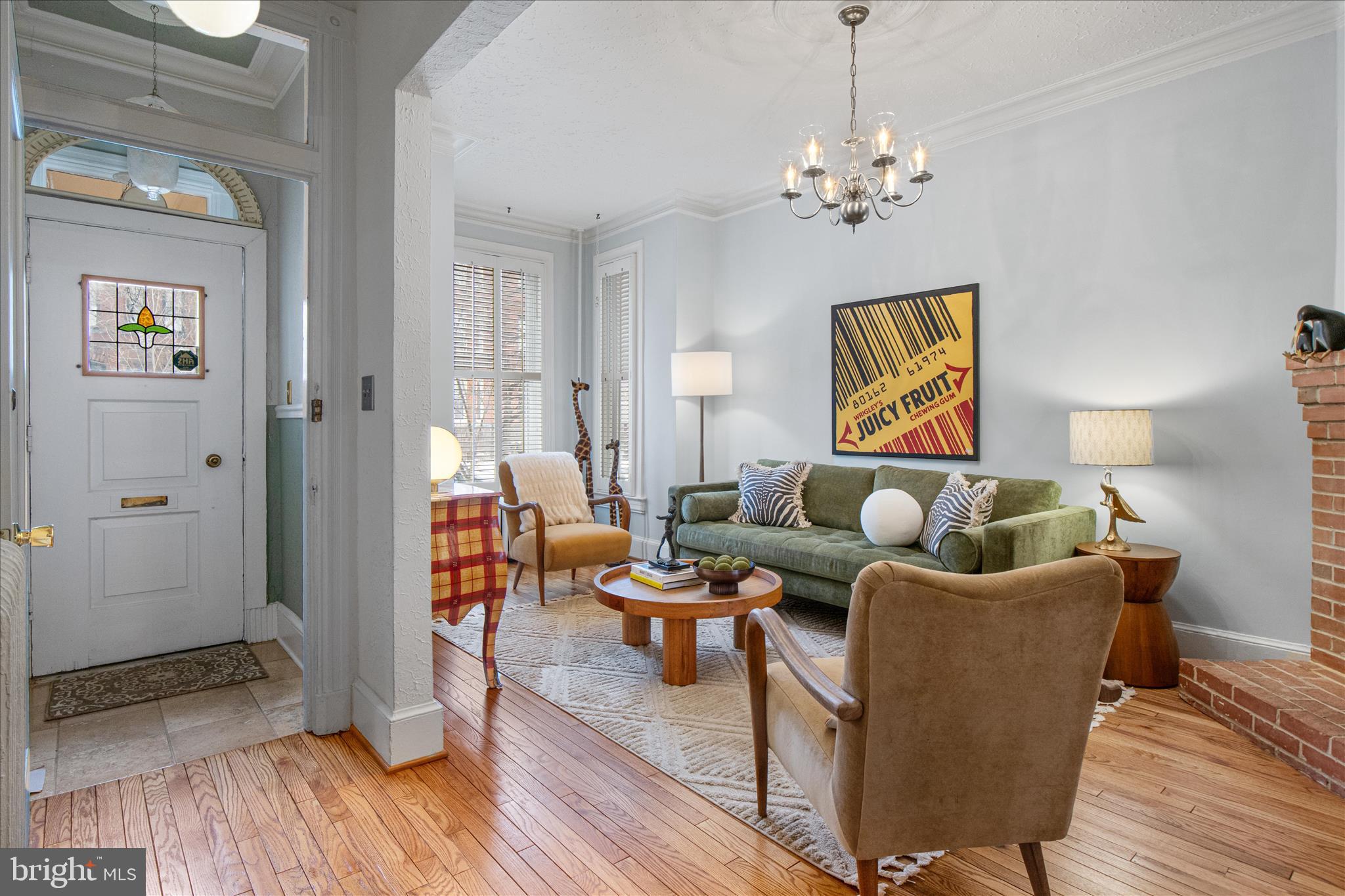 140 11th Street Northeast Washington, DC 20002 - Photo 4 of 45 a living room with furniture and a chandelier