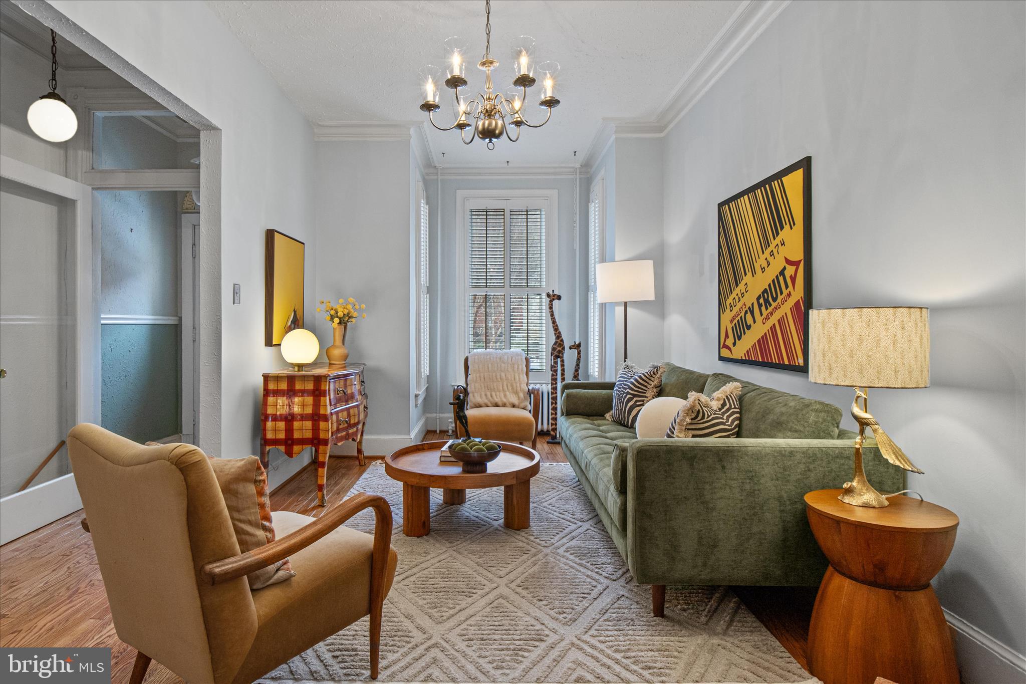140 11th Street Northeast Washington, DC 20002 - Photo 7 of 45 a living room with furniture and a chandelier