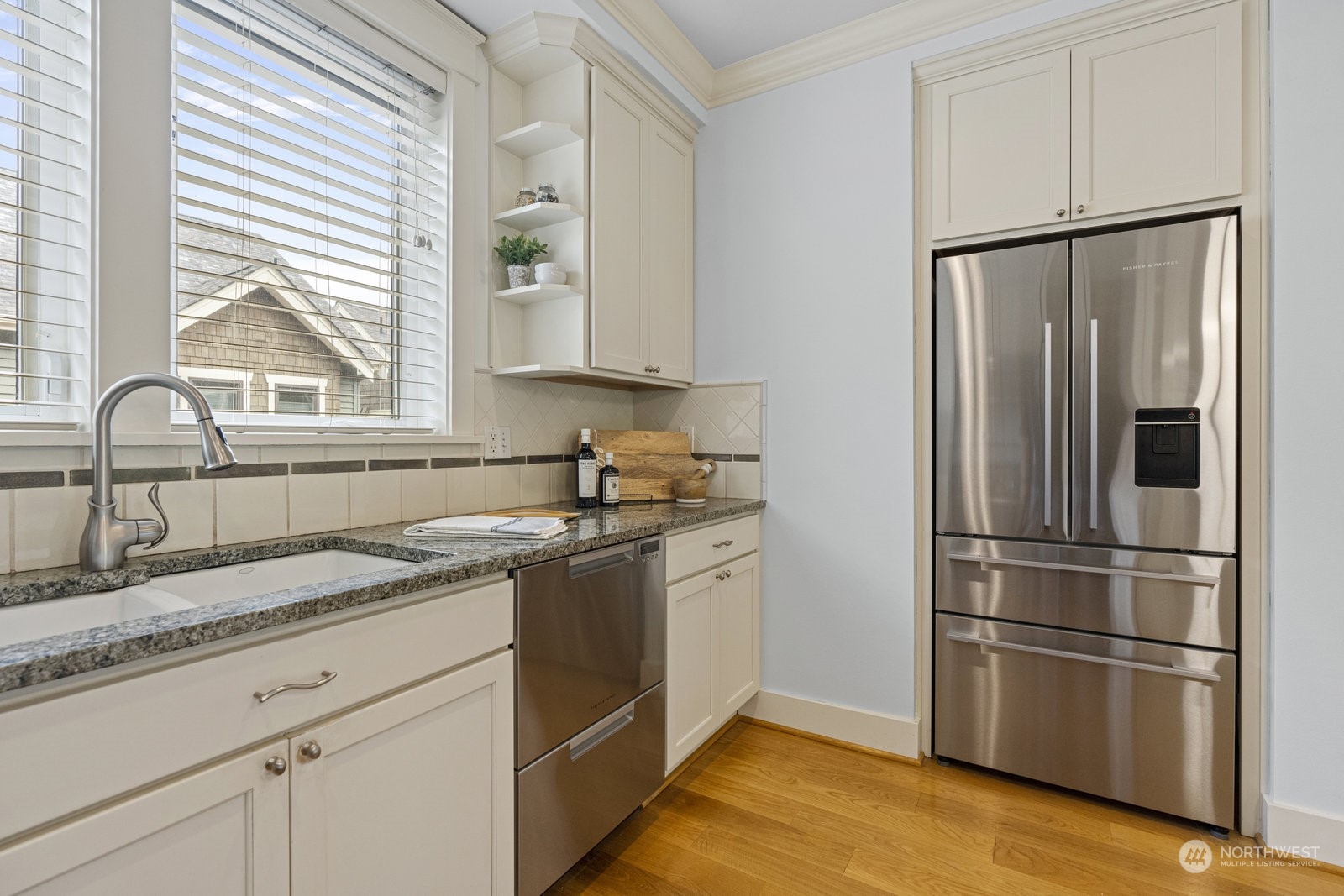 16 West Etruria Street Seattle, WA 98119 - Photo 12 of 40 a kitchen with a refrigerator stove and sink