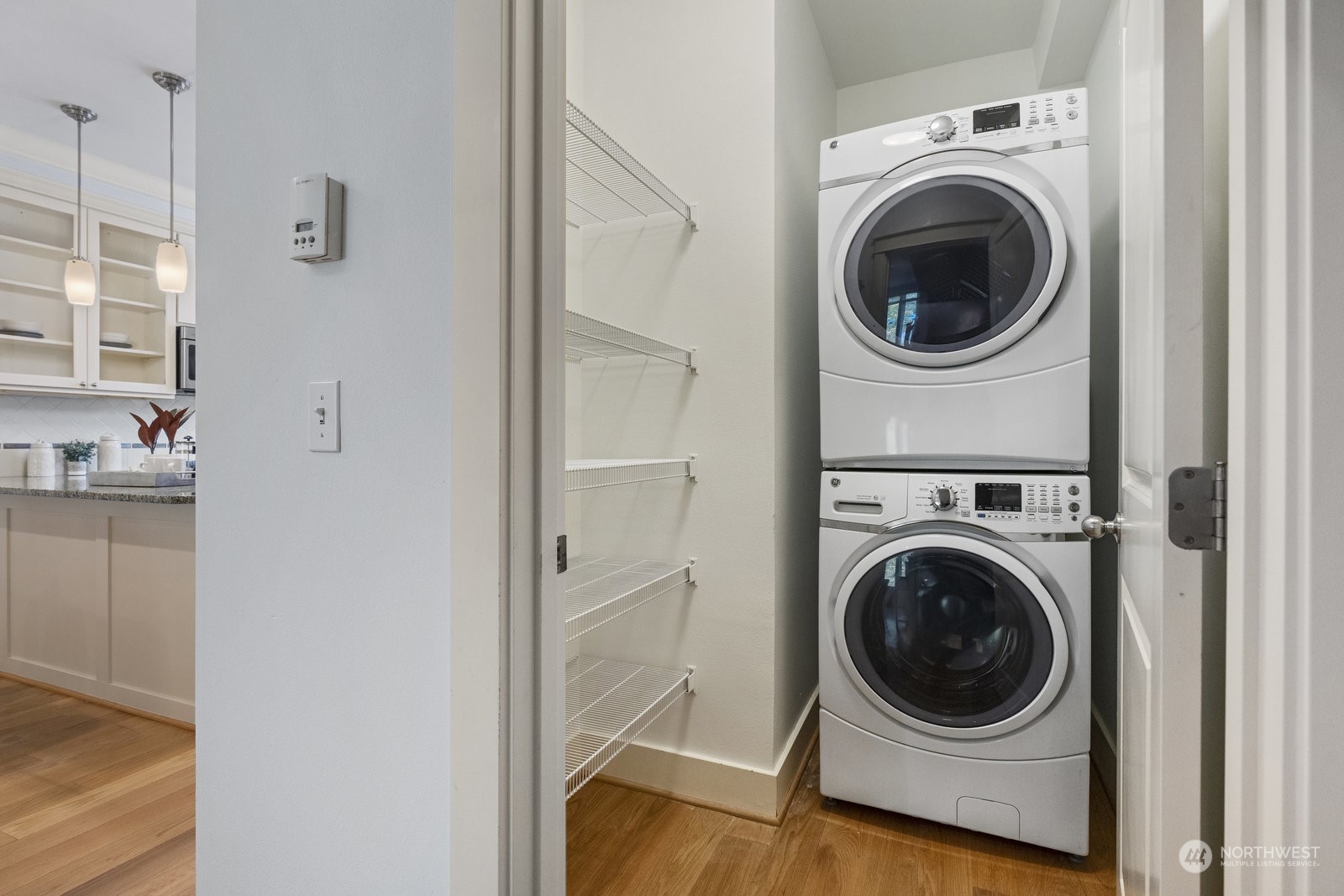 16 West Etruria Street Seattle, WA 98119 - Photo 14 of 40 a view of a hallway with washer and dryer