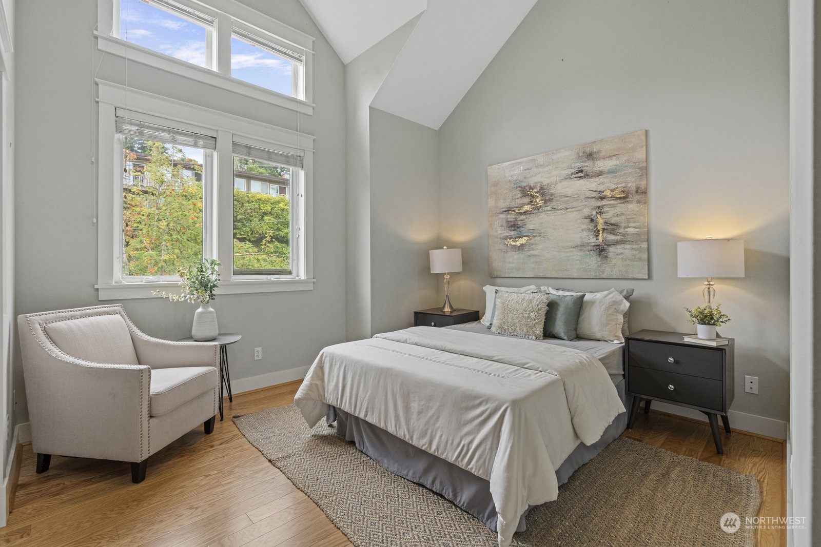 16 West Etruria Street Seattle, WA 98119 - Photo 16 of 40 a bedroom with a bed and a couch