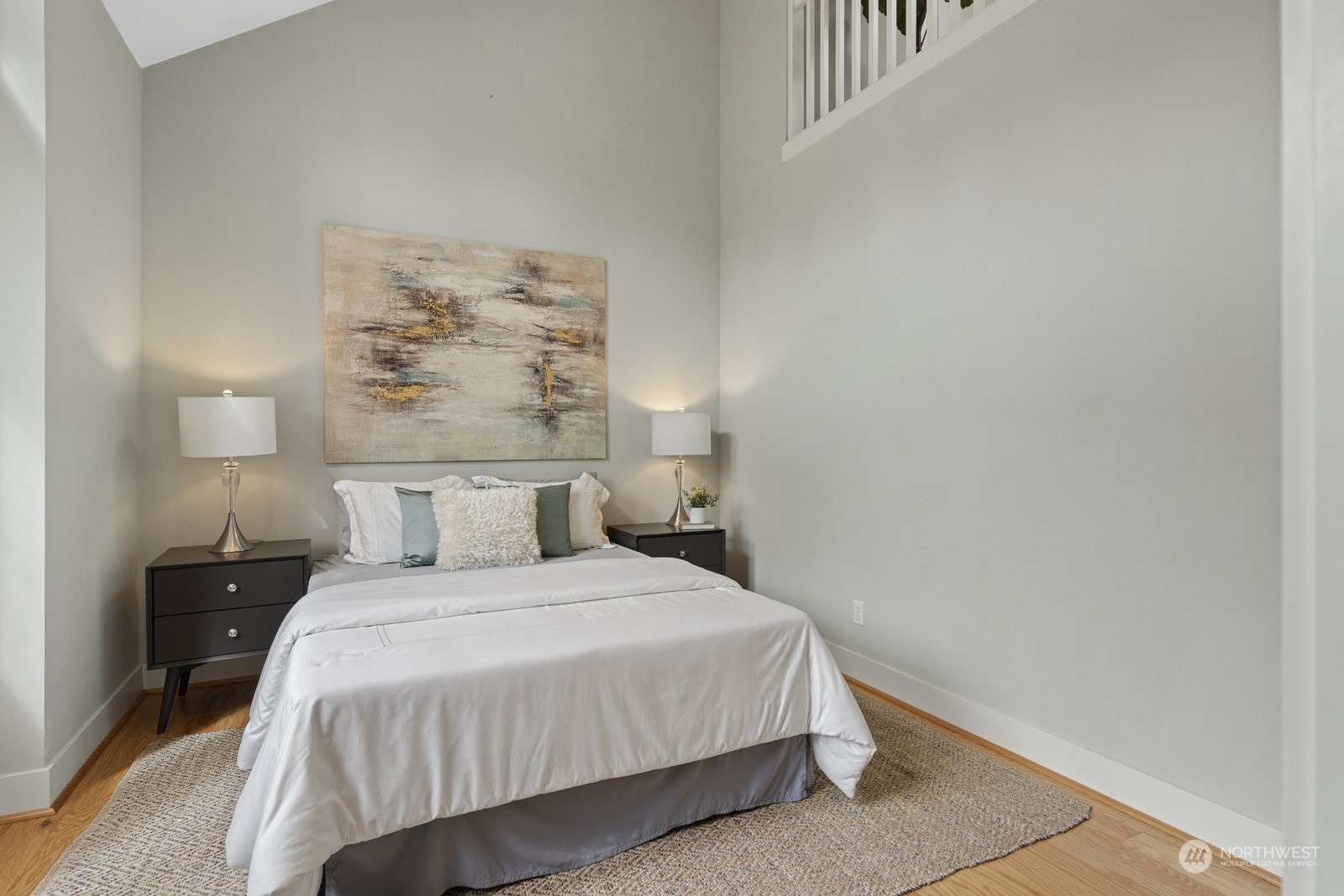 16 West Etruria Street Seattle, WA 98119 - Photo 17 of 40 a bedroom with a bed and a night stand