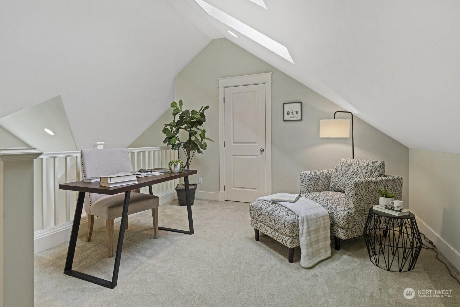 16 West Etruria Street Seattle, WA 98119 - Photo 22 of 40 a bedroom with furniture and a bed