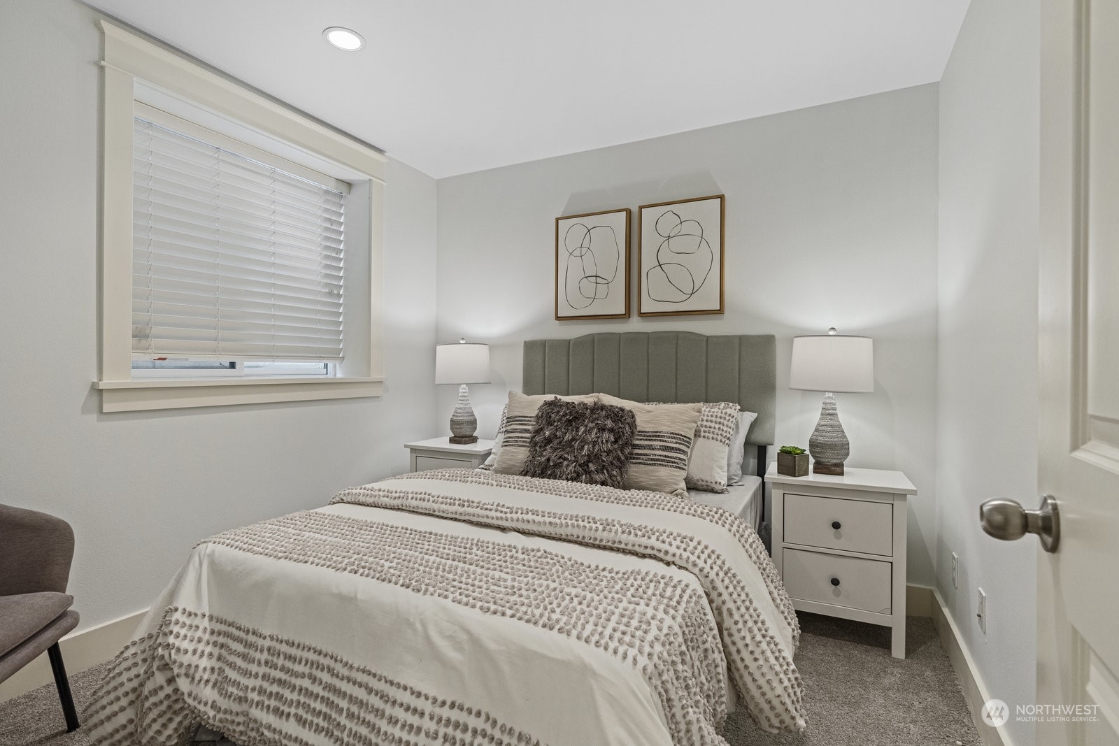 16 West Etruria Street Seattle, WA 98119 - Photo 28 of 40 a bedroom with a bed and a lamp