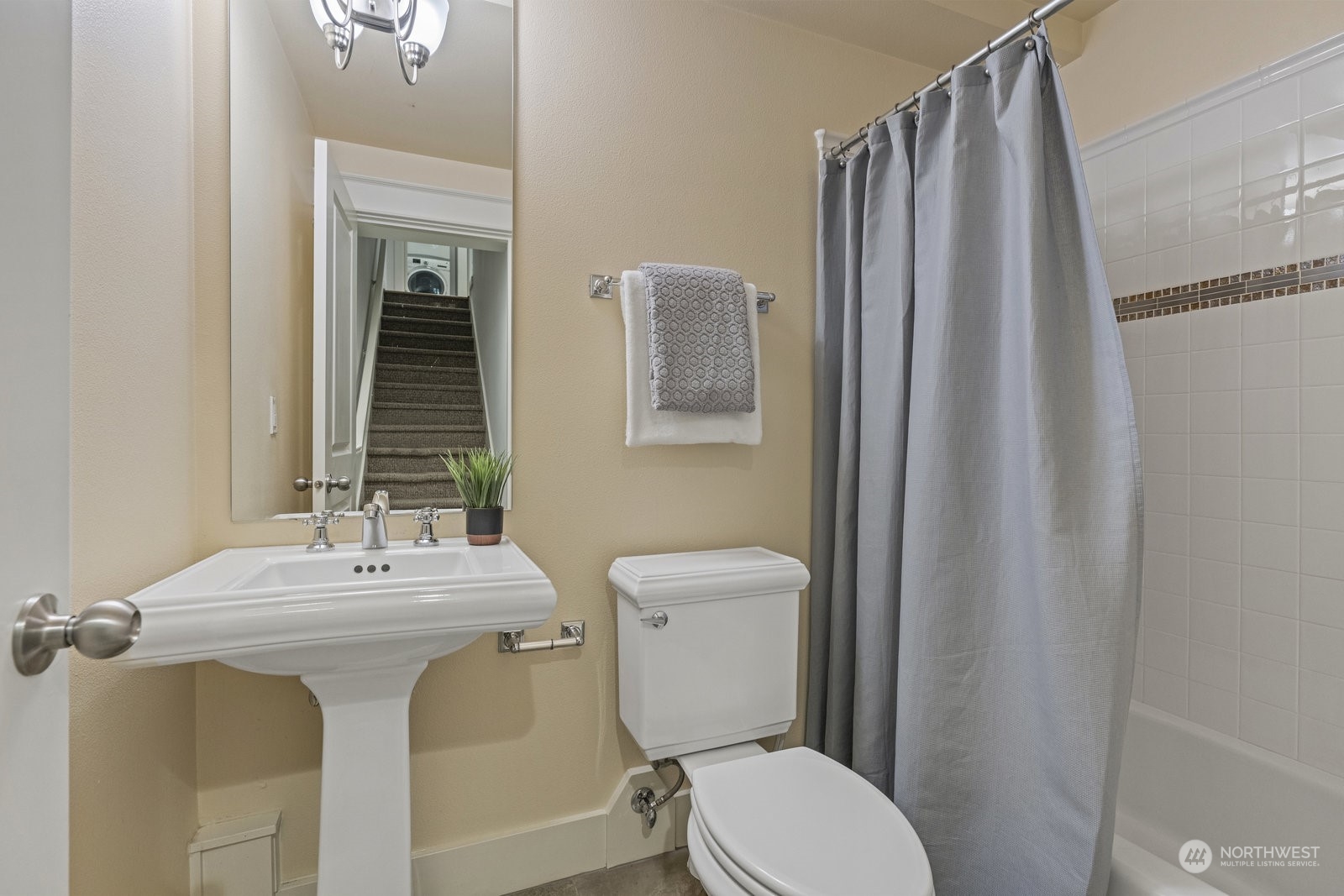 16 West Etruria Street Seattle, WA 98119 - Photo 29 of 40 a bathroom with a sink mirror and toilet