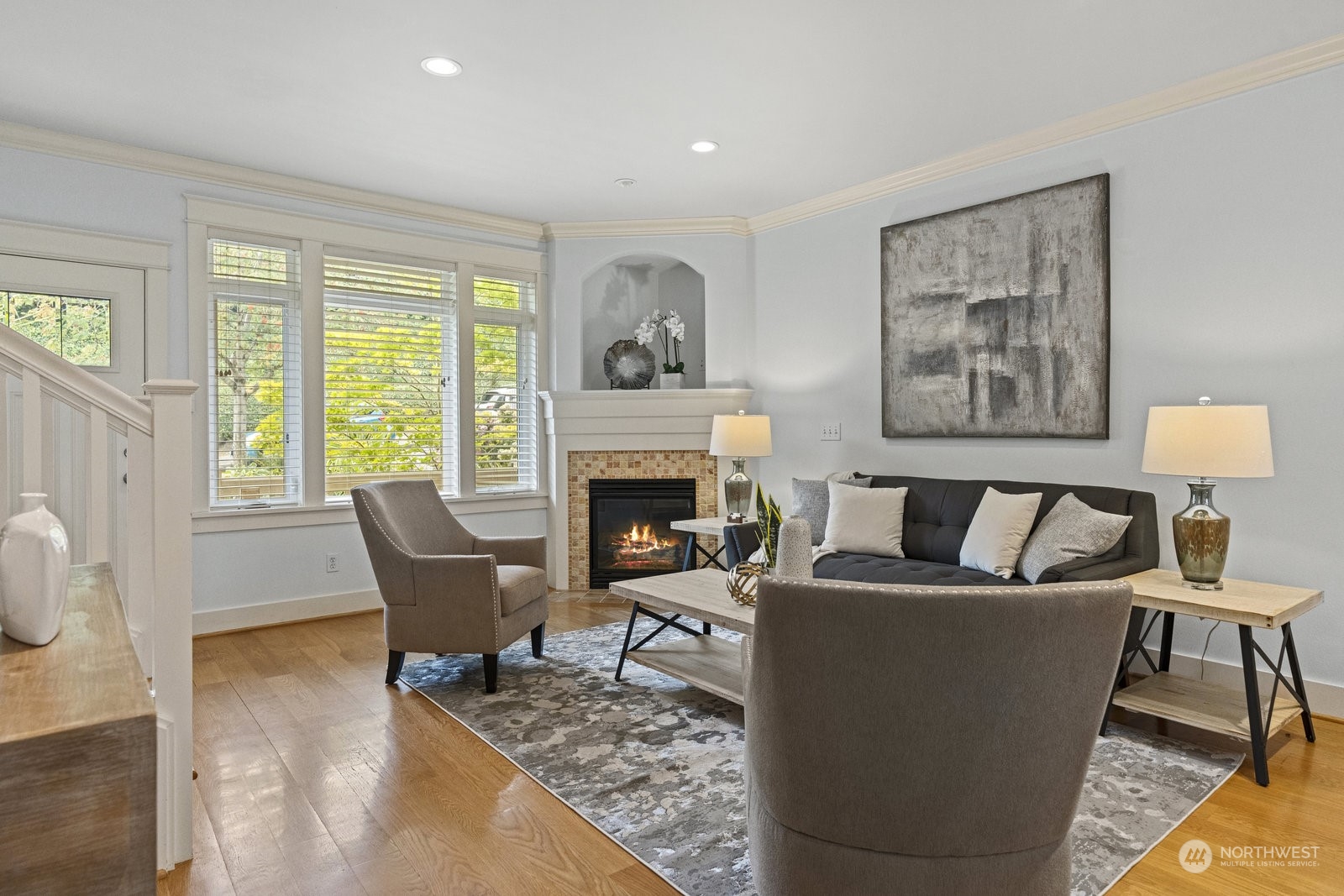 16 West Etruria Street Seattle, WA 98119 - Photo 3 of 40 a living room with furniture and a fireplace