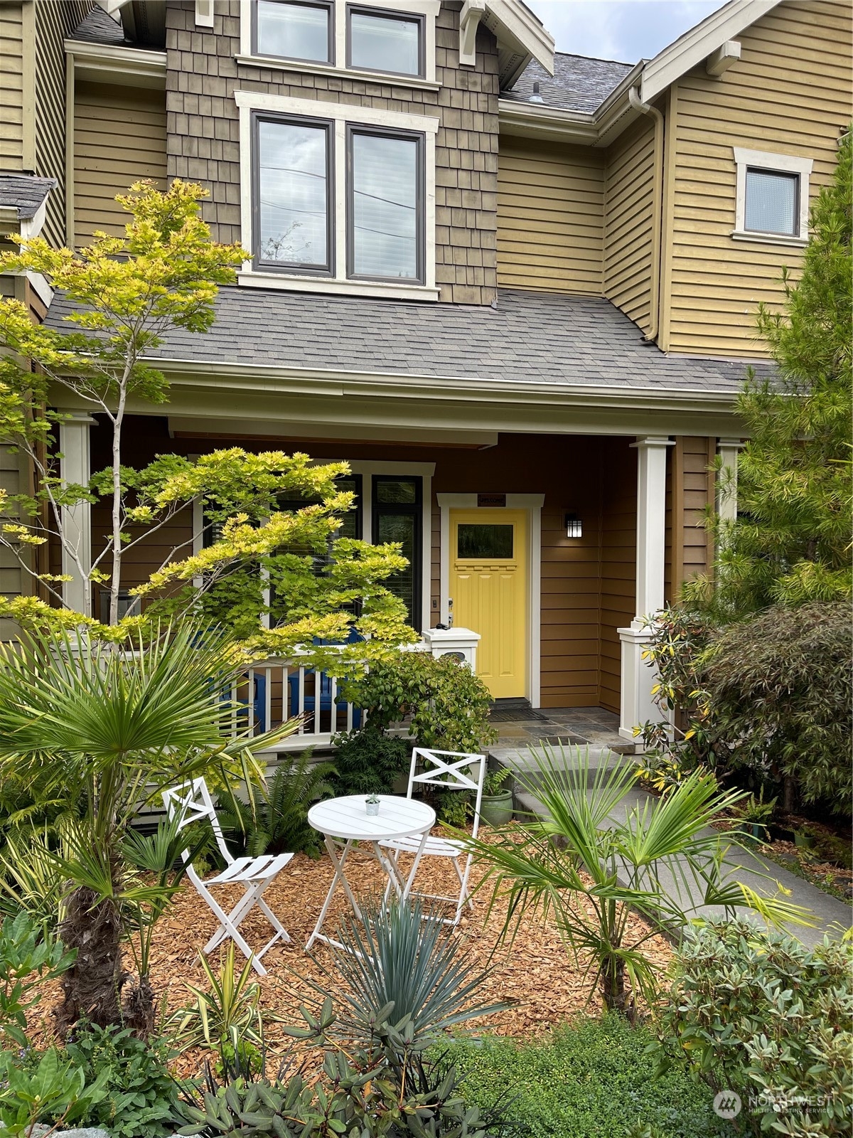 16 West Etruria Street Seattle, WA 98119 - Photo 31 of 40 a view of a house with backyard and sitting area