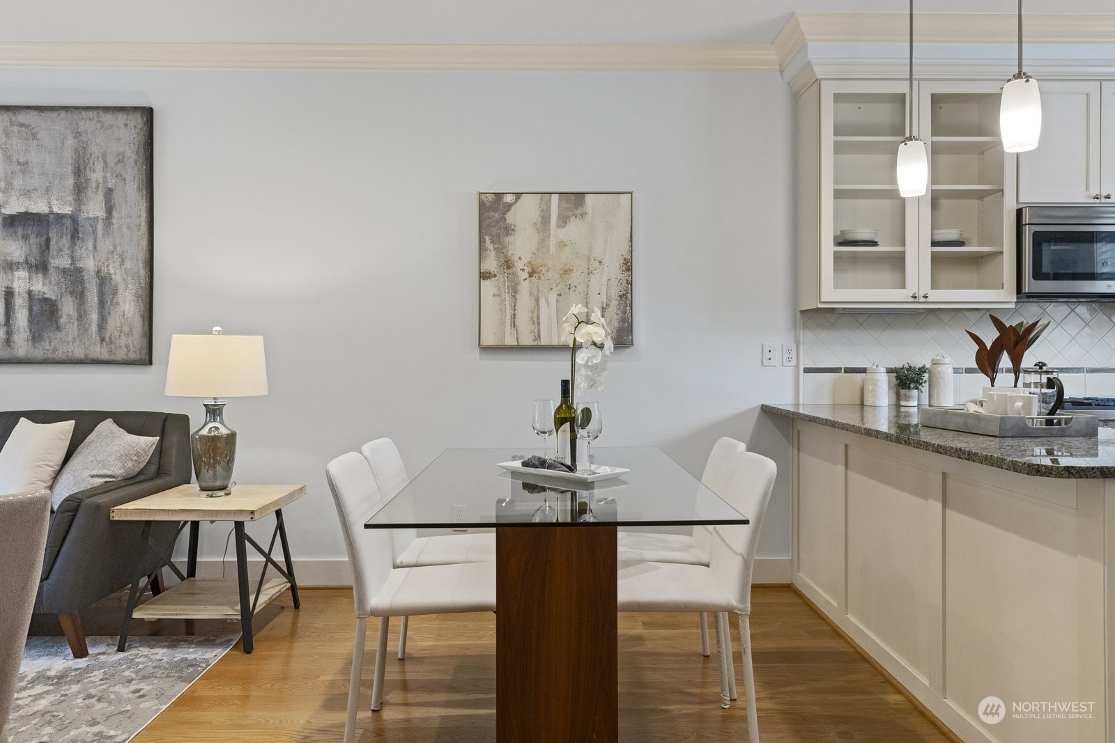 16 West Etruria Street Seattle, WA 98119 - Photo 8 of 40 a view of a kitchen with a table and chairs in it