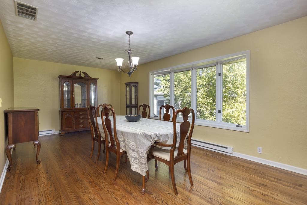 7257 Reeds Crossing Road Belvidere, IL 61008 - Photo 5 of 35 a view of a dining room with furniture window and wooden floor