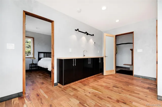 a bedroom with a bed and a closet