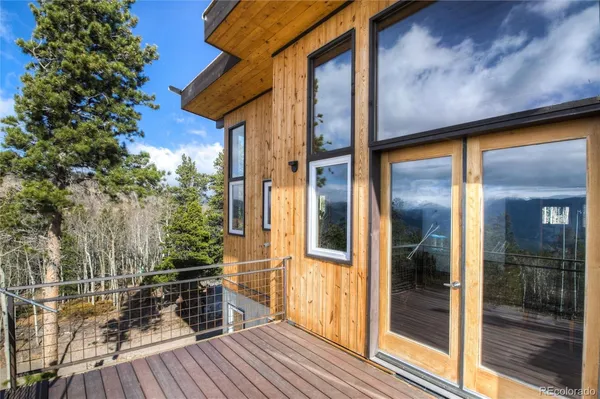 a view of outdoor space with deck and living room
