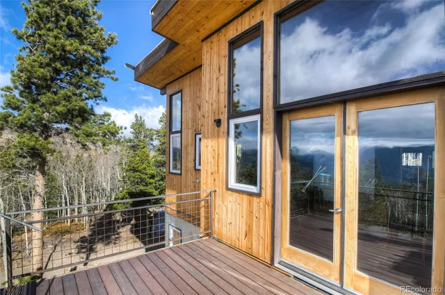 a view of outdoor space with deck and living room