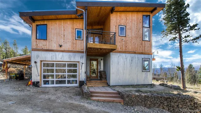 a front view of a house with a large window