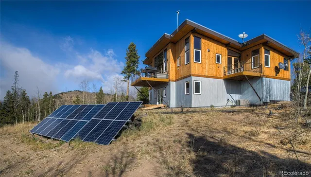 a view of a house with wooden fence and floor