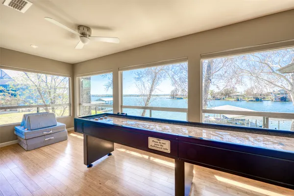 a living room with furniture and a floor to ceiling window