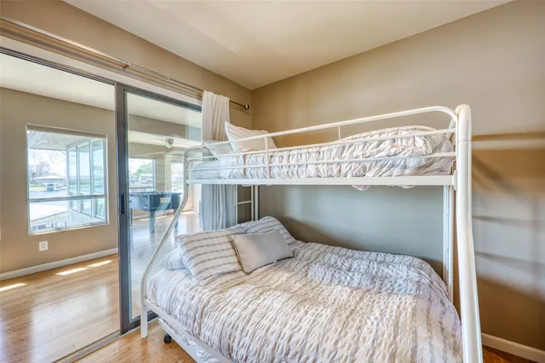 a bedroom with a large bed and a large window