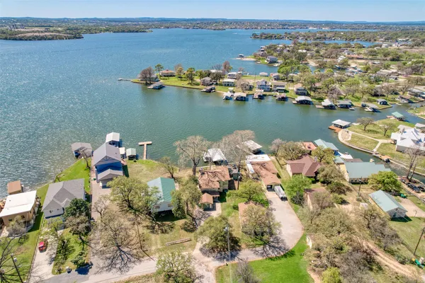 an aerial view of a houses with ocean view