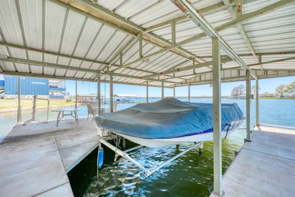 a front view of a building with a garden