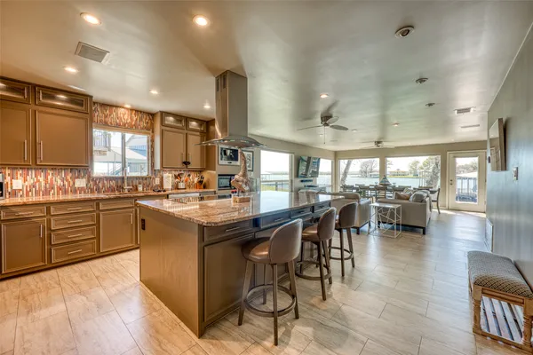 a kitchen with lots of counter top space and living room