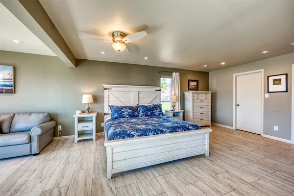 a living room with a bed and furniture