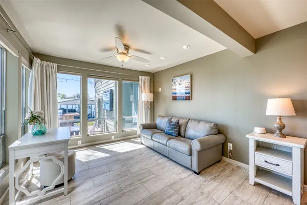 a living room with furniture and a large window