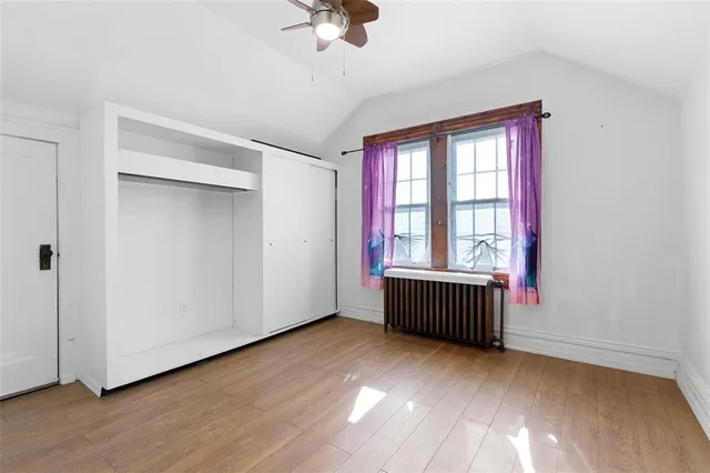 wooden floor and window in an empty room