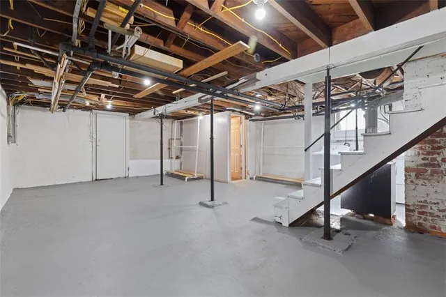 a view of an empty room with stairs