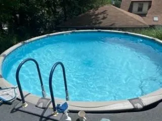a view of a swimming pool with a backyard