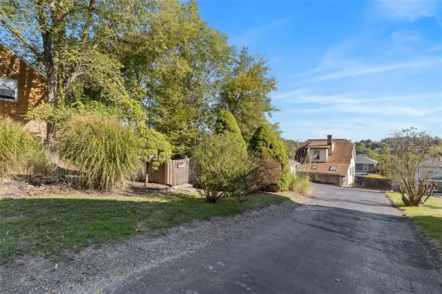 a view of a road with a building in the background