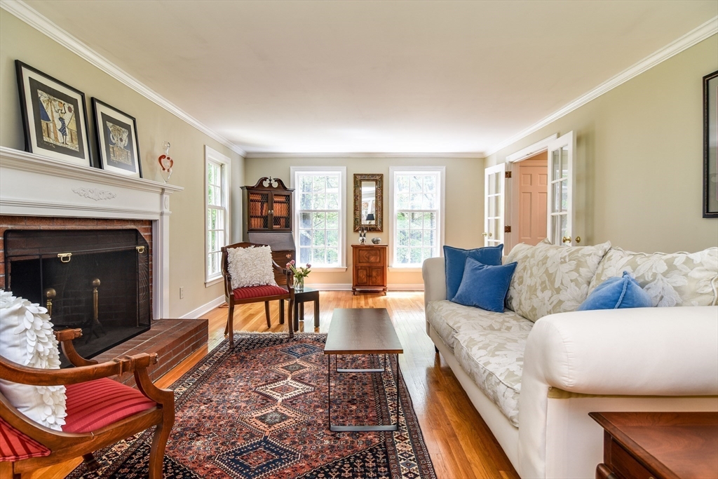 114 Hunters Ridge Road Concord, MA 01742 - Photo 7 of 38 a living room with furniture and a fireplace
