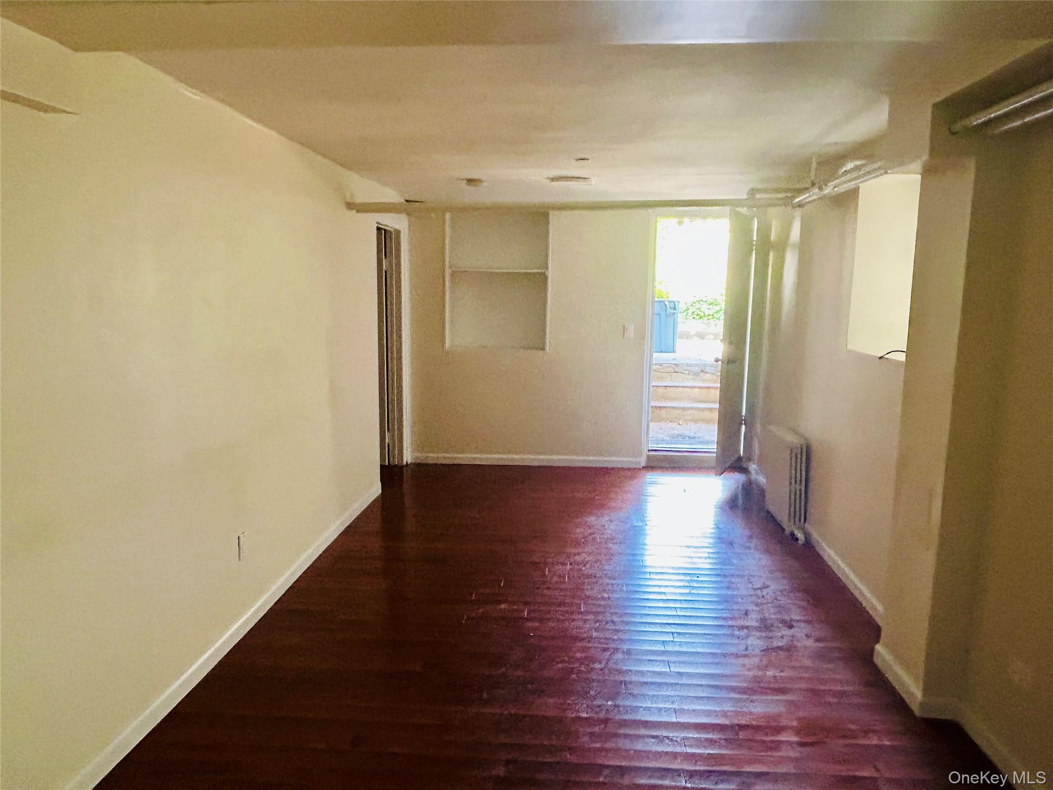 2910 Tenbroeck Avenue Bronx, NY 10469 - Photo 3 of 9 a view of a hallway with wooden floor