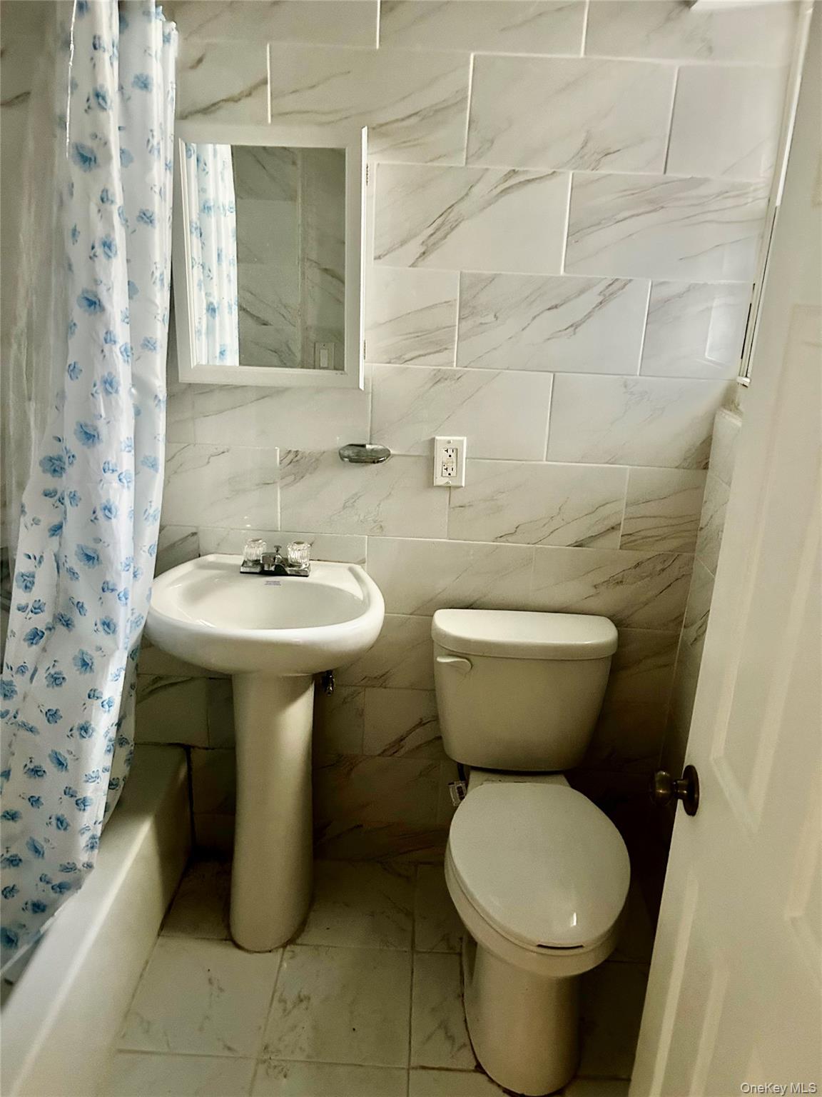 2910 Tenbroeck Avenue Bronx, NY 10469 - Photo 6 of 9 a bathroom with a sink toilet and a mirror