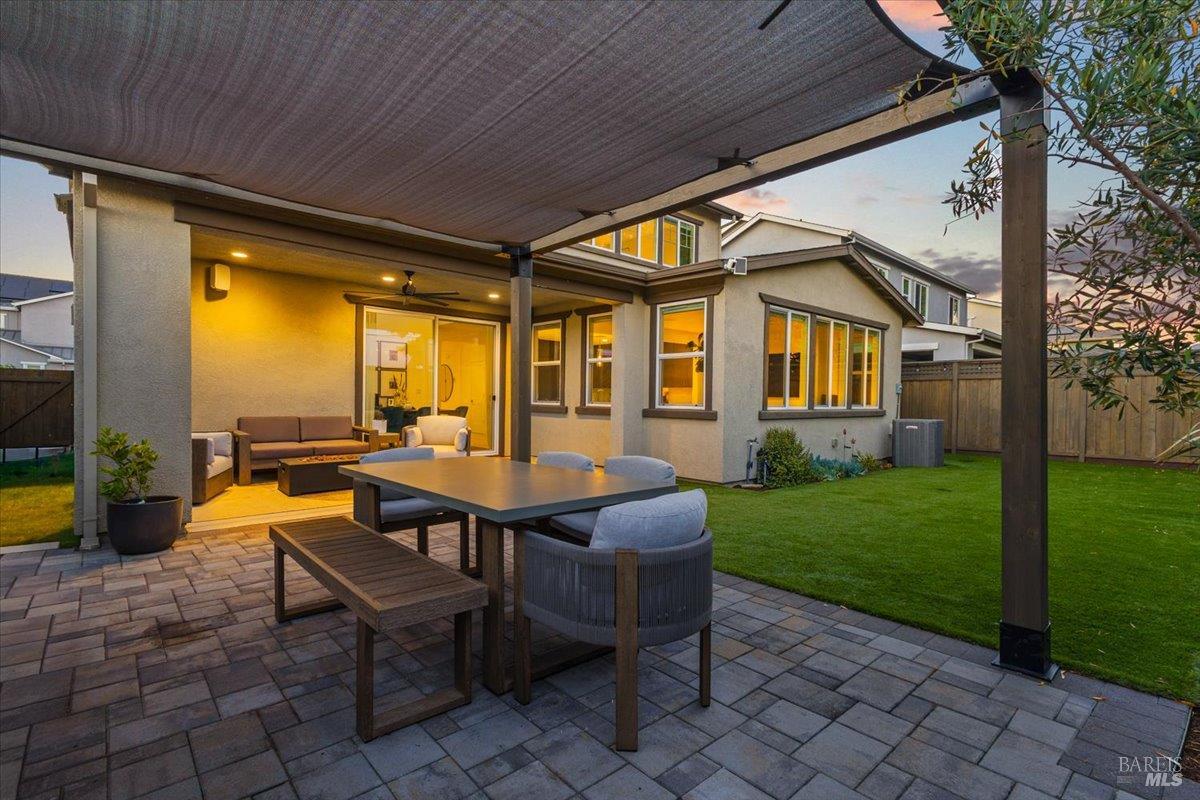 1469 Oak Circle Rohnert Park, CA 94928 - Photo 39 of 42 Evenings Done Right As the sun sets, the backyard comes alive with warm lighting, comfortable gathering spaces, and a seamless connection to the home's indoor living areas.