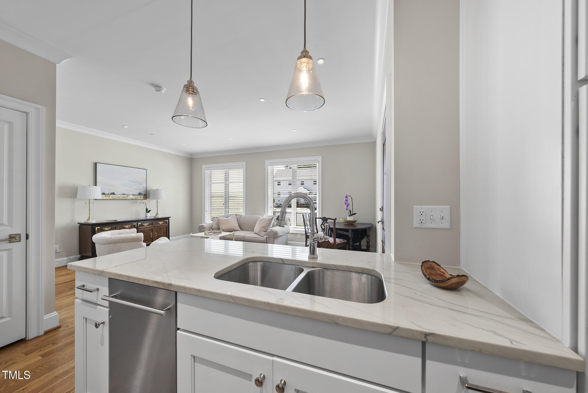 606 Daniels Street, Unit B Raleigh, NC 27605 - Photo 16 of 27 a kitchen with a sink a counter space and cabinets