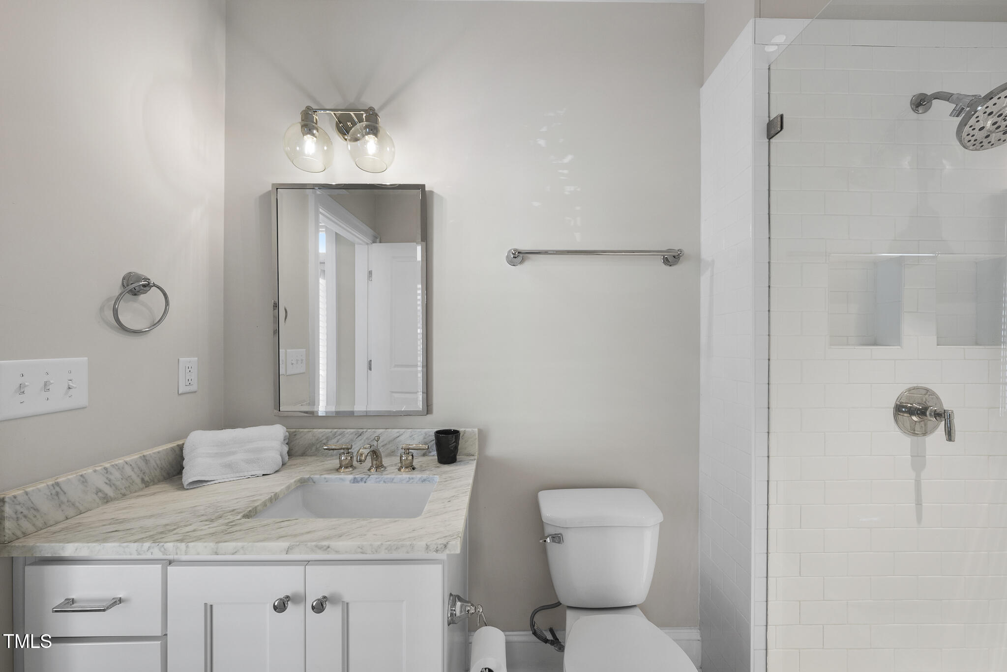 606 Daniels Street, Unit B Raleigh, NC 27605 - Photo 19 of 27 a bathroom with a granite countertop sink toilet and shower