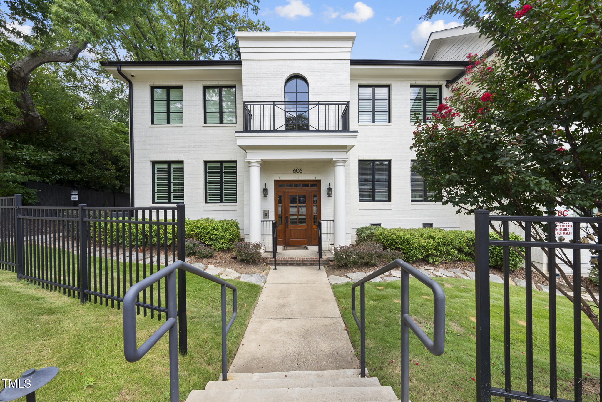 606 Daniels Street, Unit B Raleigh, NC 27605 - Photo 2 of 27 a front view of a house with yard and green space