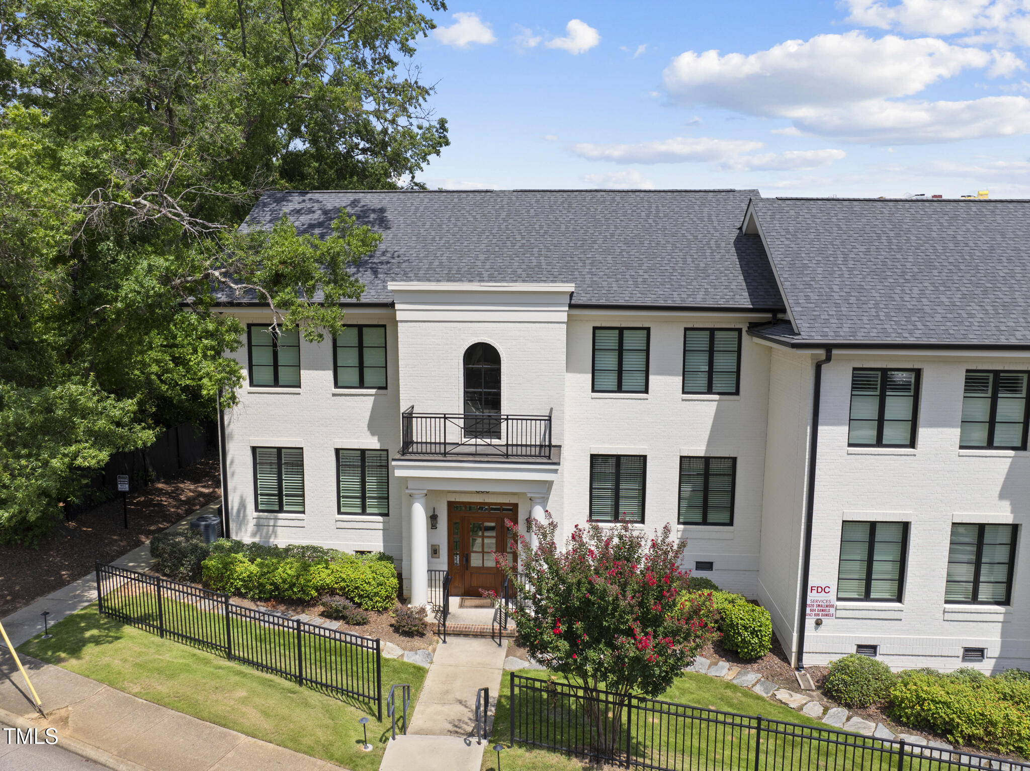 606 Daniels Street, Unit B Raleigh, NC 27605 - Photo 24 of 27 a front view of a house with a yard