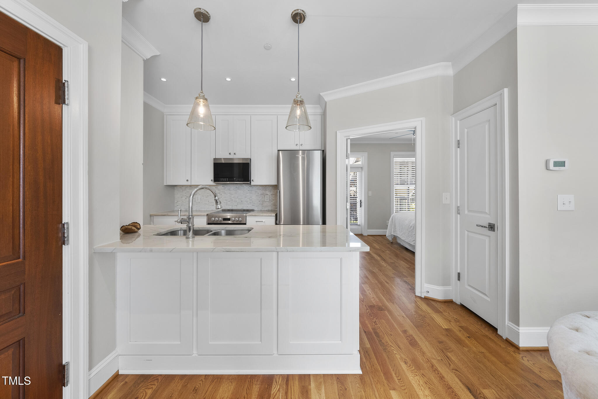 606 Daniels Street, Unit B Raleigh, NC 27605 - Photo 4 of 27 a view of a kitchen and a chandelier