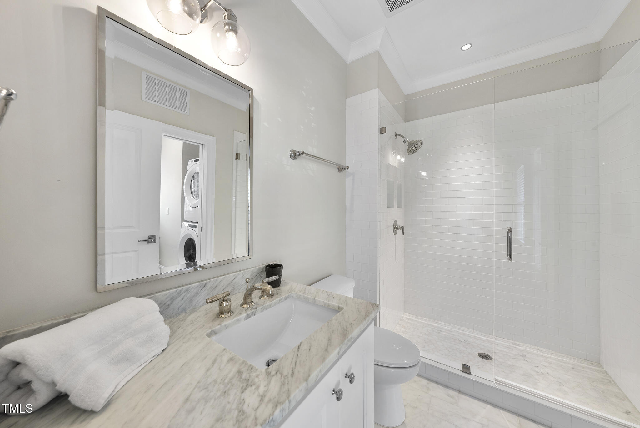 606 Daniels Street, Unit B Raleigh, NC 27605 - Photo 7 of 27 a bathroom with a bathtub shower sink and toilet